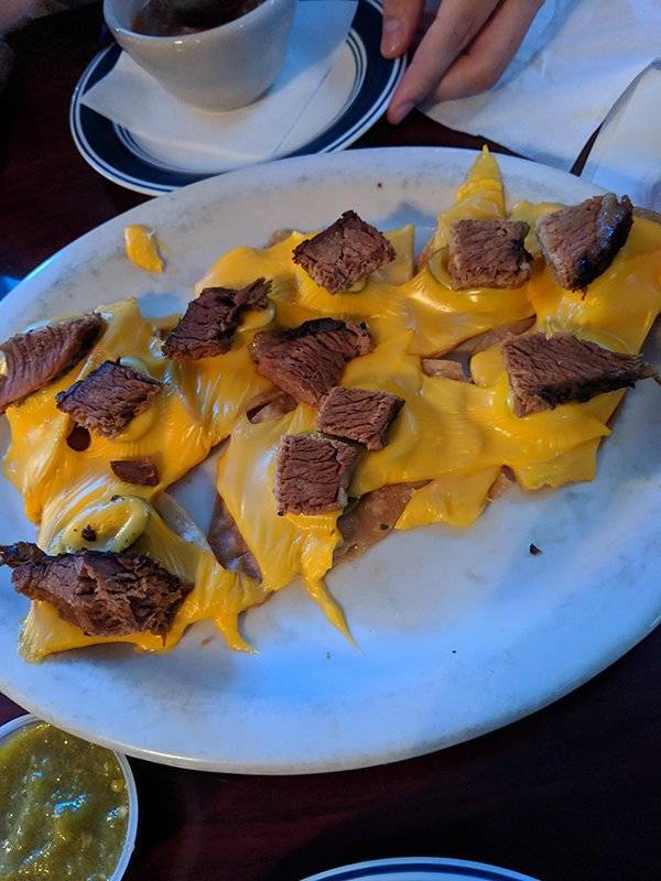Food monstrosities of pieces of melted cheese and meat