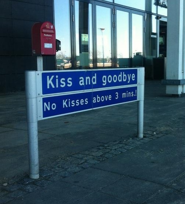 street sign - Kiss and goodbye No Kisses above 3 mins.!