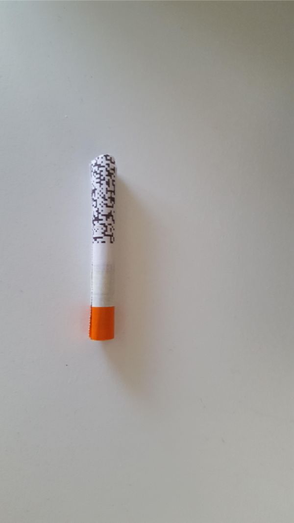 A rolled up train ticket looks like a lit cigarette.