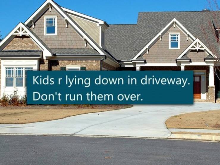 stucco house - Kids r lying down in driveway. Don't run them over.