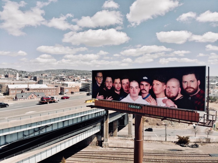 He put their family photo on a billboard.