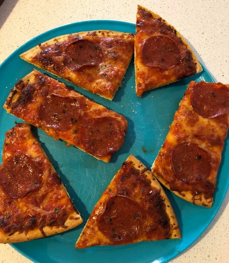 He cut pizza as to not slice through any pepperoni.