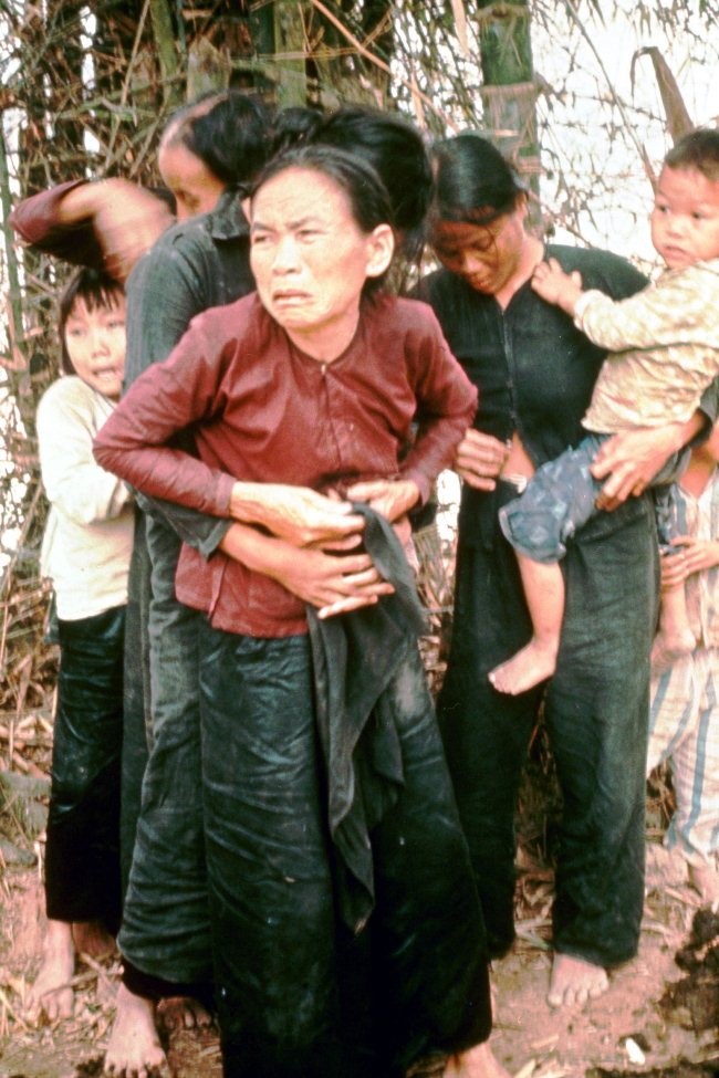 Minutes after this photo was taken this woman and her children were killed by US soldiers, during the Vietnam war.