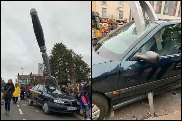 giant object - Huge fork through a car