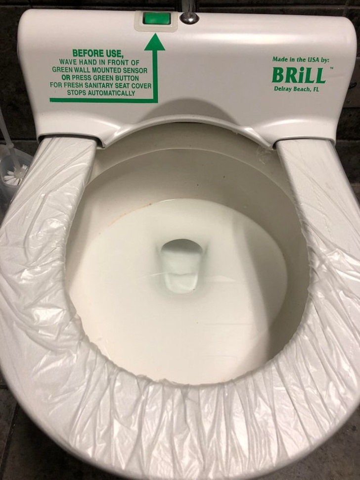 This toilet puts out a fresh sanitary seat cover.