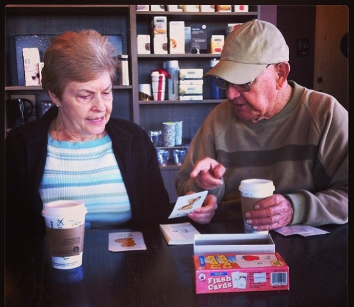 Husband teaching his wife the alphabet after she lost her memory.