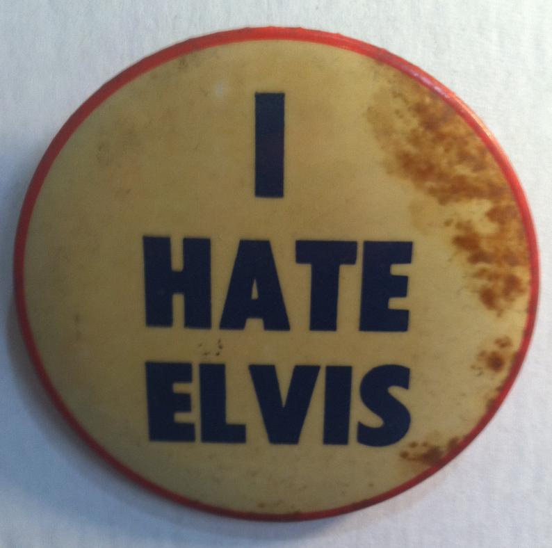 Elvis Presley's manager sold "I Hate Elvis" badges to make money from people not buying Elvis merchandise.