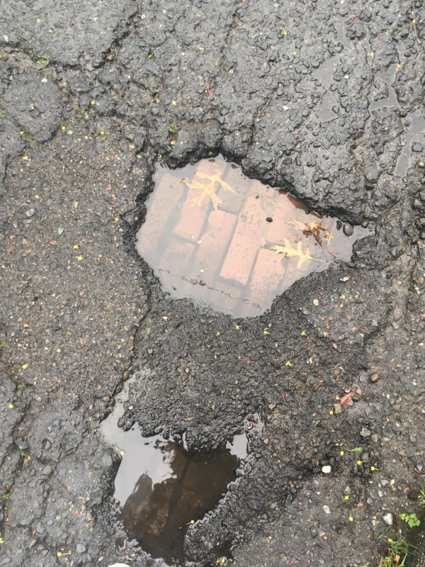Old brick road under the asphalt.