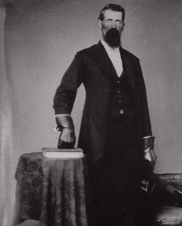 Pinkerton Detective wearing lead gloves, 1875.