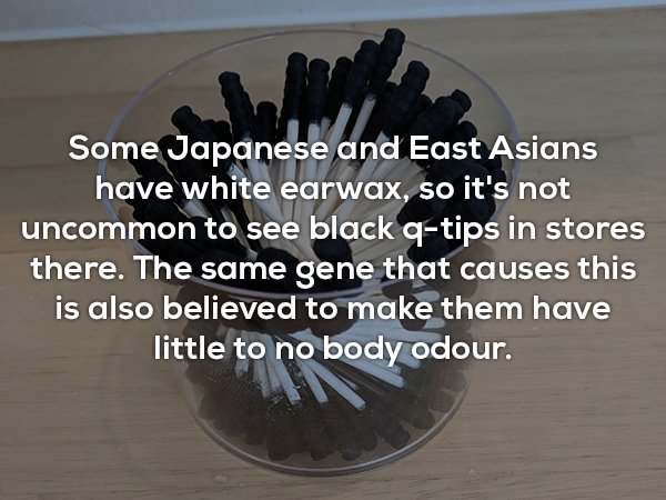 Some Japanese and East Asians have white earwax, so it's not uncommon to see black qtips in stores there. The same gene that causes this is also believed to make them have little to no body odour.