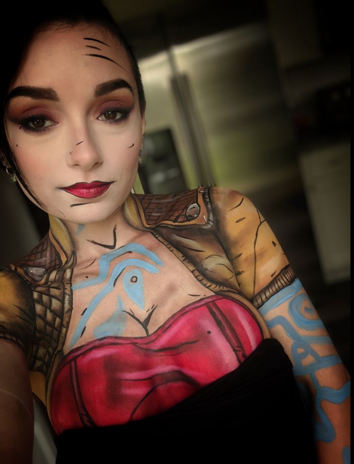 beautiful girl cosplaying using body paint as a big part of her costume