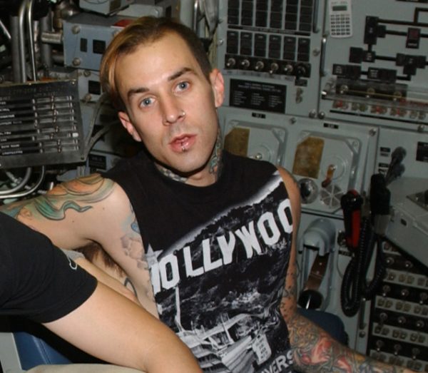 Travis Barker - He survived a plane crash with severe burns that required 16 surgeries.