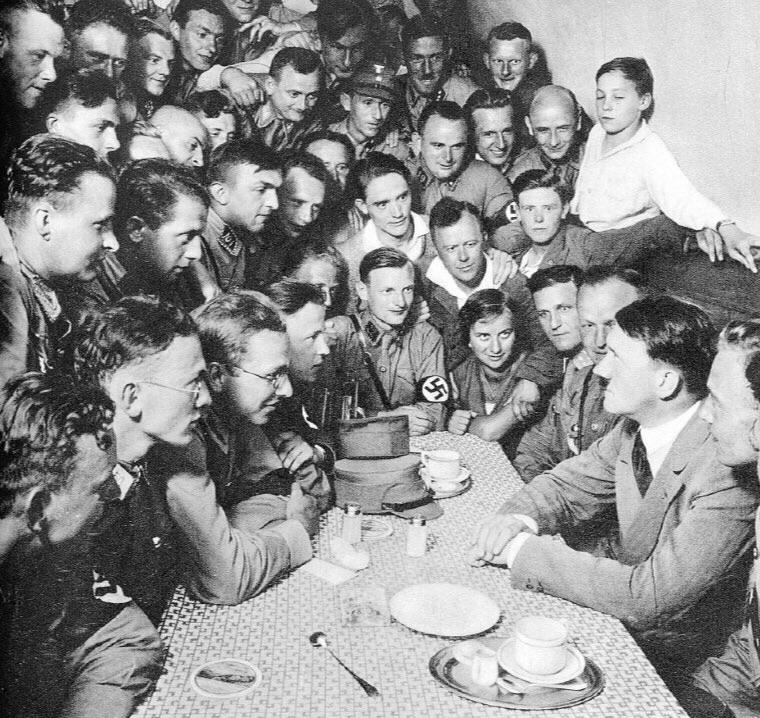 Adolf Hitler with a group of brown shirts in Berlin, 1933.