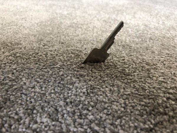 Key in a thick carpet.