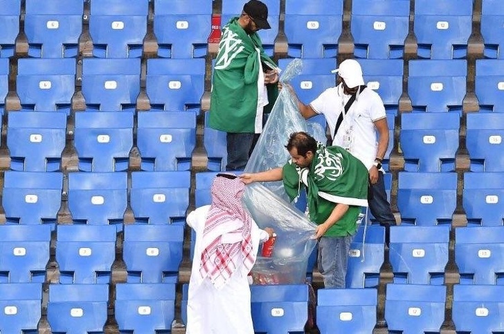 Fans clean up after the world cup.