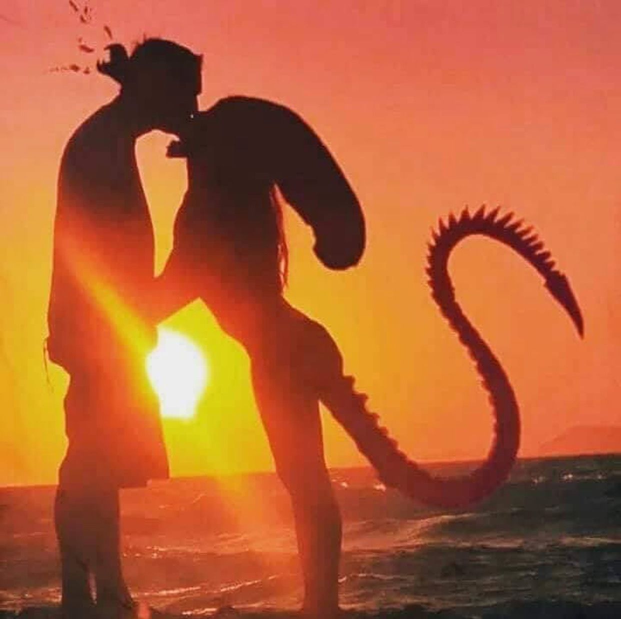 romantic beach picture with human and xenomorph