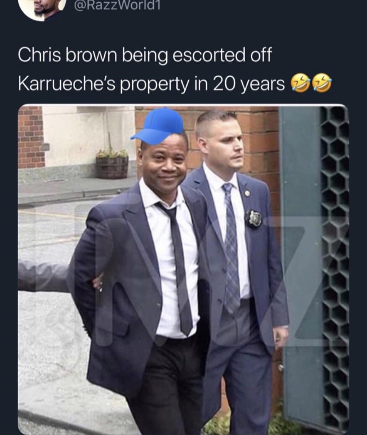 suit - Chris brown being escorted off Karrueche's property in 20 years o