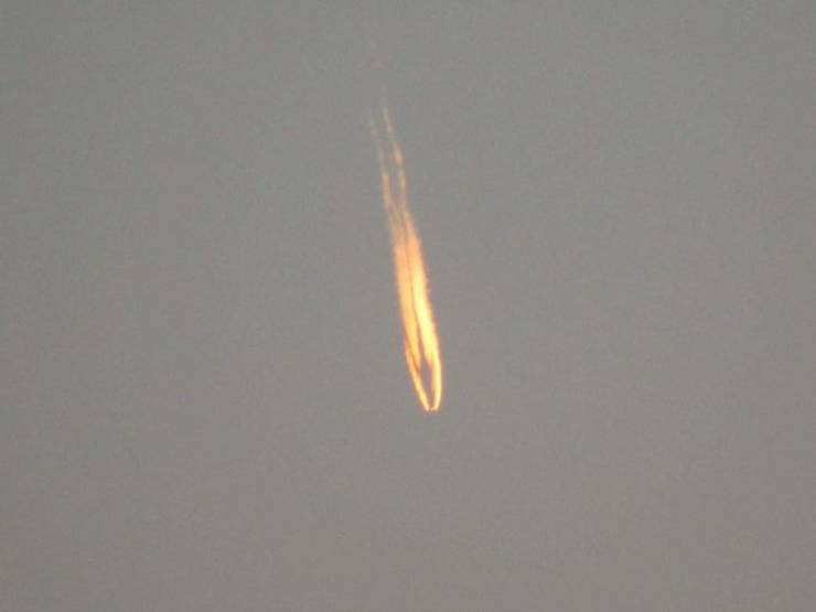 A condensation trail produced by an aircraft.