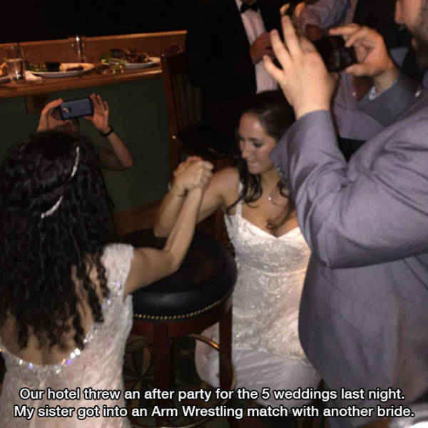 bride armwrestling - Our hotel threw an after party for the 5 weddings last night. My sister got into an Arm Wrestling match with another bride.