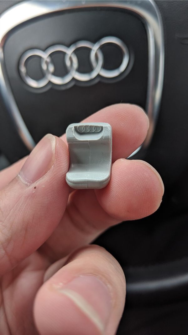 The clip for the car's sun visor broke off revealing a tiny hidden Audi logo.