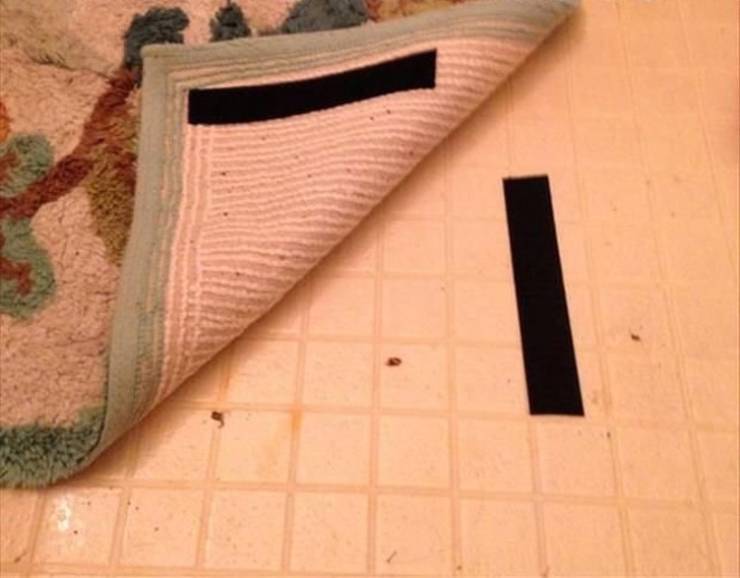 Use adhesive Velcro to prevent a rug from sliding on the floor.