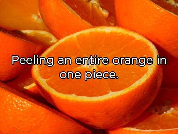 Peeling an entire orange in one piece.