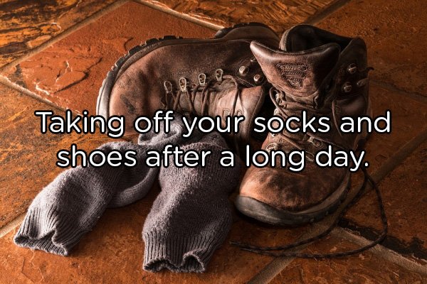 work boots in bed - Taking off your socks and shoes after a long day.