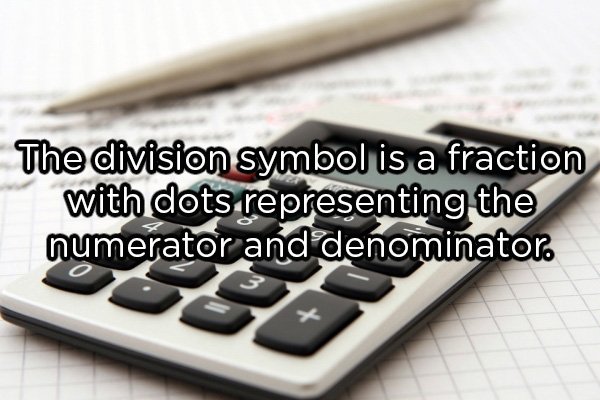 The division symbol is a fraction with dots representing the numerator and denominator.