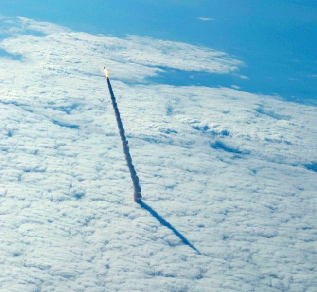 A space shuttle leaving the Earth’s atmosphere.