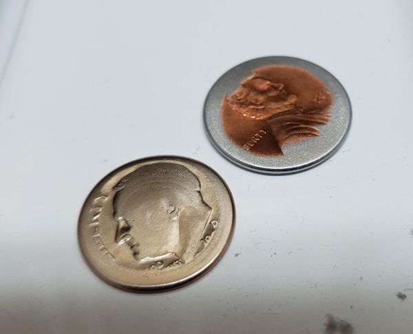 This dime and penny stuck in a dryer for years.