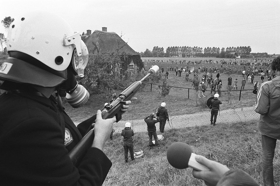 Dutch police officer shoots teargas ammunition from the muzzle of an M1 carbine, during a blockade and demonstration against the nuclear power plant Dodewaard. September 18, 1981.