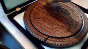 An Uzbekistani serving bowl carved from a single piece of wood.
