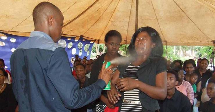weird pic pastor spraying insecticide