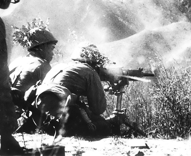 Japanese troops fire a Type 92 heavy machine gun, China, 1944.