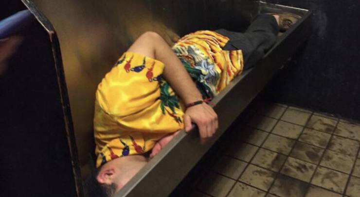 guy asleep in urinal