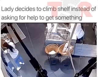 stupid Lady decides to climb shelf instead of asking for help to get something