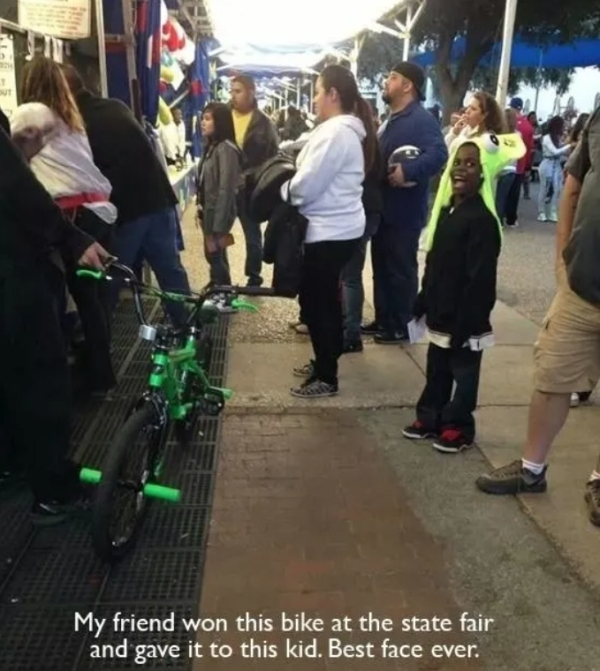 goodness in the world - My friend won this bike at the state fair and gave it to this kid. Best face ever.
