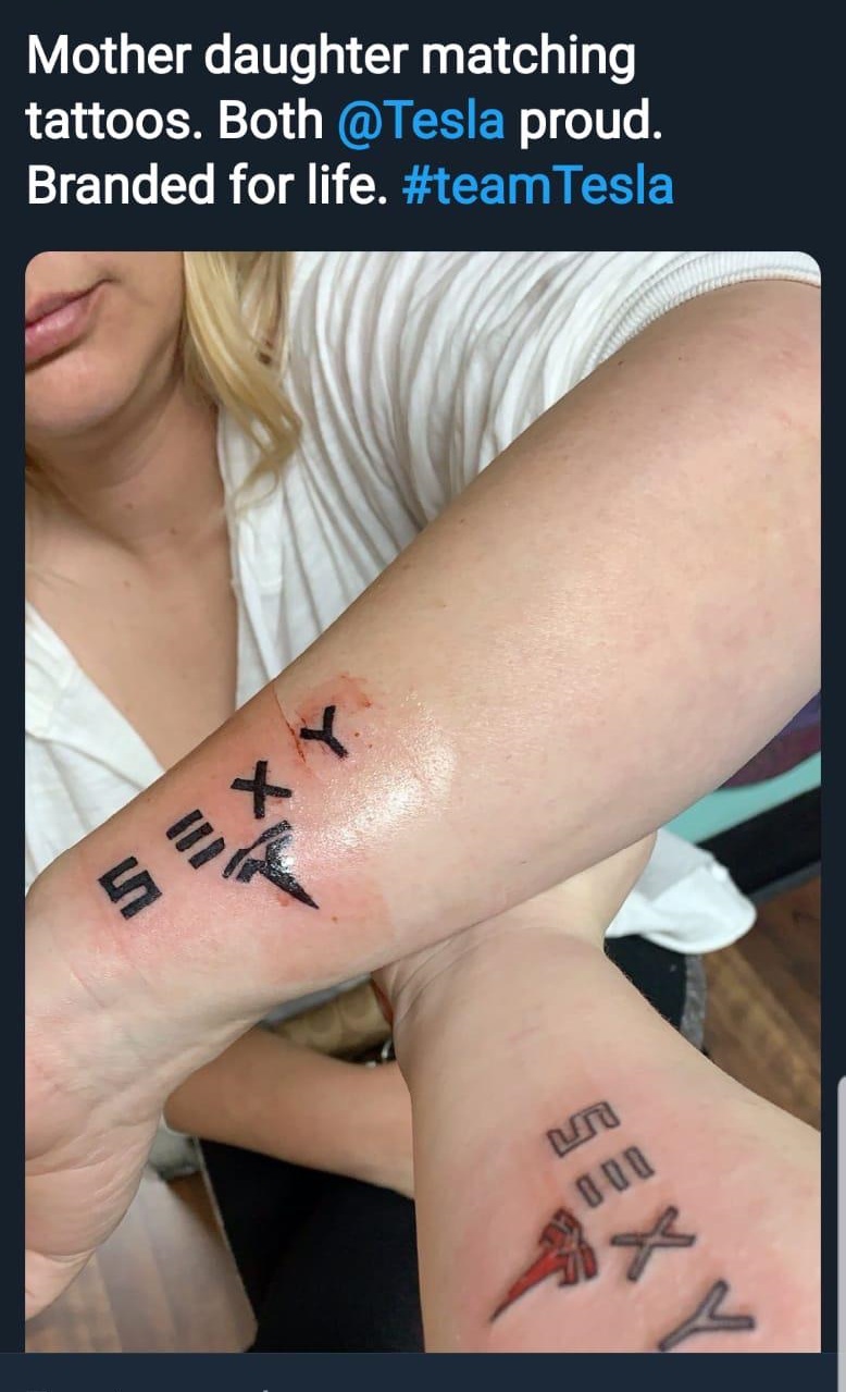 Mother daughter matching tattoos. Both proud. Branded for life. Tesla 5E Xy