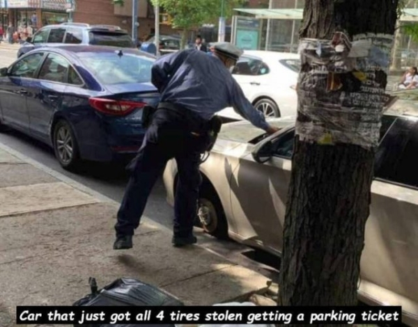 Parking - Car that just got all 4 tires stolen getting a parking ticket