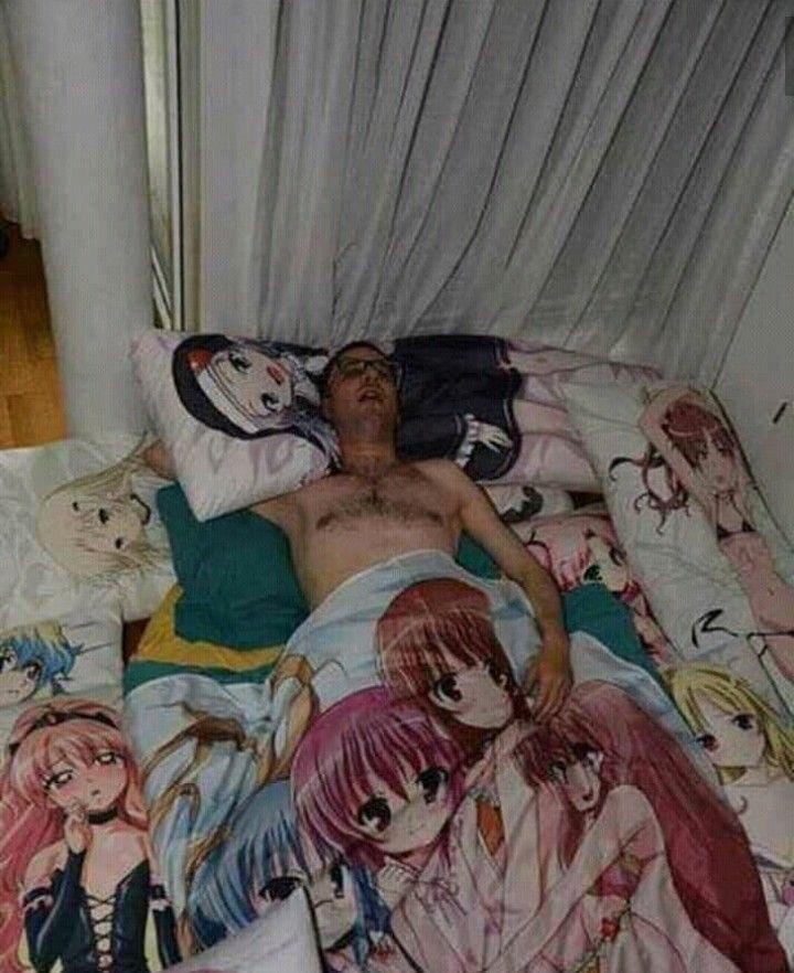 man sleeping on anime sheets