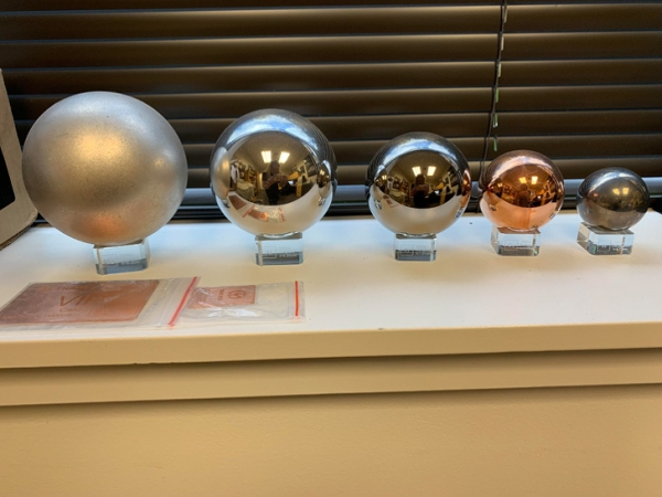 Each ball weighs 2 lb (from left to right: magnesium, aluminum, titanium, copper, and tungsten).