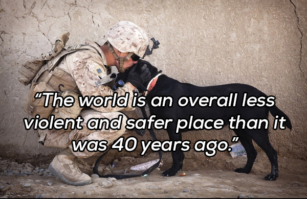 soldier kissing dog - "The world is an overall less violent and safer place than it was 40 years ago."