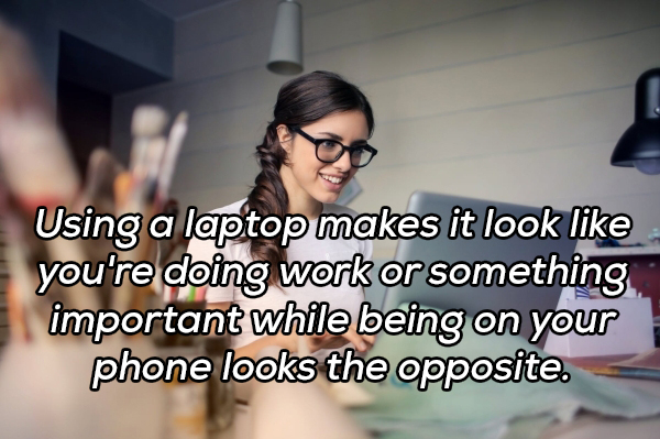 photo caption - Using a laptop makes it look you're doing work or something important while being on your phone looks the opposite.