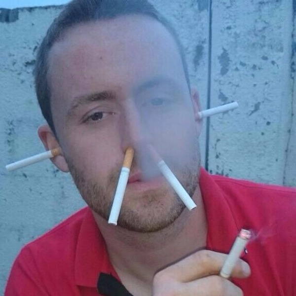 man has cigarettes in his nose and ears