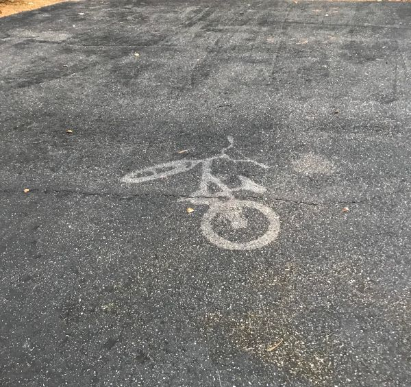 “This outline of my son’s bike after a windless drizzle.”