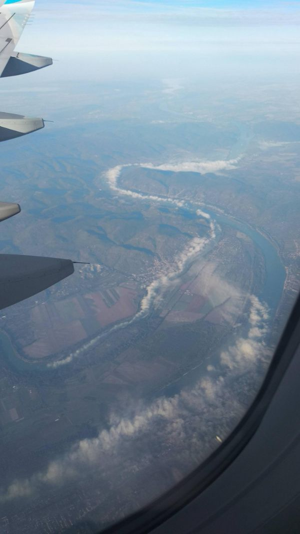 “Clouds forming over a river.”