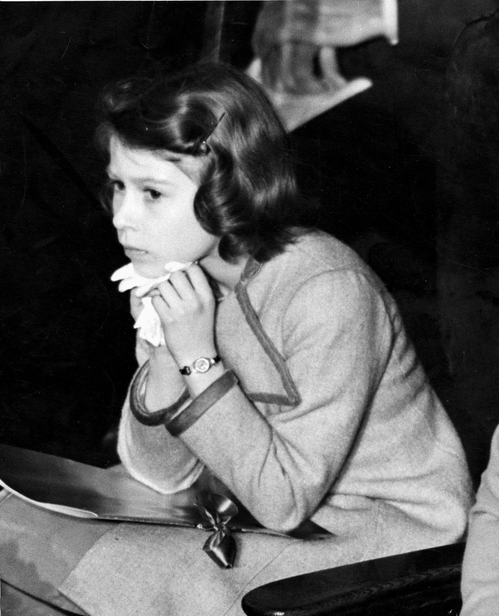 Little heiress to the British throne, princess Elizabeth, bored at a concert for children in Westminster, 1937