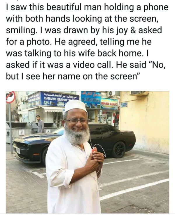 wholesome smiling meme - I saw this beautiful man holding a phone with both hands looking at the screen, smiling. I was drawn by his joy & asked for a photo. He agreed, telling me he was talking to his wife back home. I asked if it was a video call. He sa