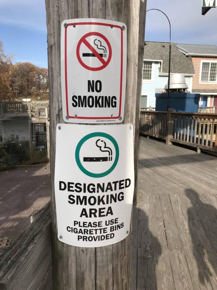 street - No Smoking Designated Smoking Area Please Use Cigarette B Ite Bins Provided