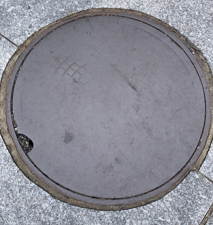 manhole in sidewalk